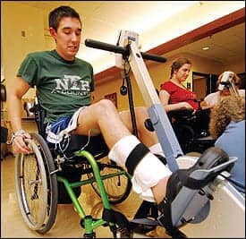 A client works out on an FES bike