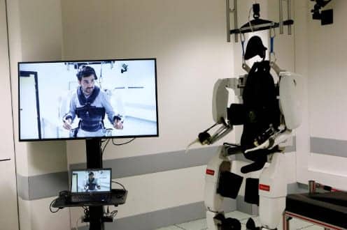 Paralyzed Man Hails ‘Feat’ of Walking Again with Robot Exoskeleton