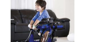 child using a pediatric assistive device to move around the home