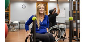 close-up of an Exercise for Life participant exercising in her wheelchair